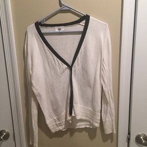 White sweater with black lined collar